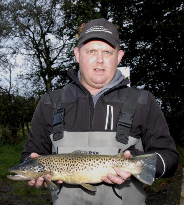 Angler showing his catch at Lough Owel