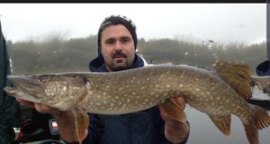 Angler Darren holding his pike catch