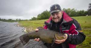 Tench Galore in Co. Roscommon Angler with large tench