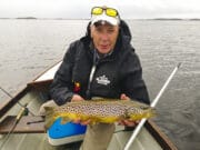 Rising waters make for tough sport on Corrib Angler in boat holding trout