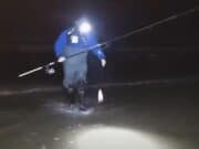 VIDEO: Bass fishing to make us all jealous Angler in surf landing a fish