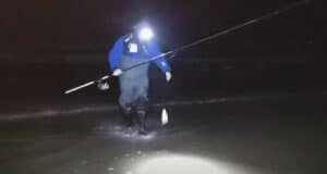 VIDEO: Bass fishing to make us all jealous Angler in surf landing a fish
