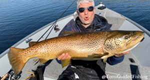 Monster trout from Corrib! Man in boat holding huge trout