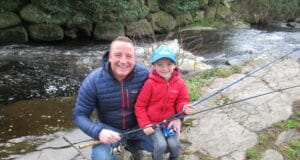 Father and son fish on the River Dodder on opening day