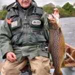 Brendan Smith with a trout 4 lbs. 4 ounces caught on a dry mayfly