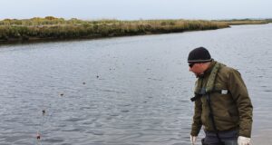13kms of illegal nets seized last year Inland Fisheries Ireland staff member John O’Connor in Kerry seizing an illegal fishing net from the River Feale in 2020.