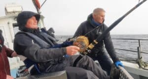 Playing a bluefin tuna onboard Fiona Tee
