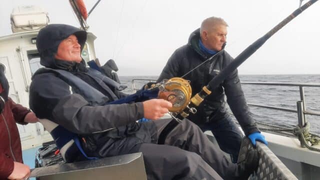 Playing a bluefin tuna onboard Fiona Tee