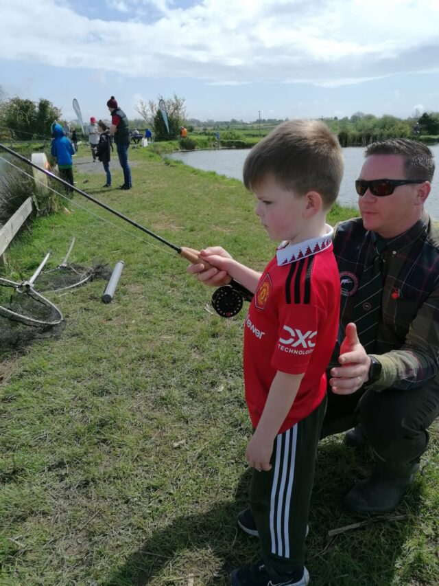 teaching a young angler to cast