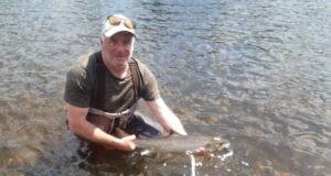 Garrett Ruigrok releasing a 7 lbs salmon caught on 5th June at the Ridge Pool