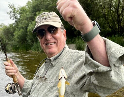 Greg Barbosa with a river Nore brown trout
