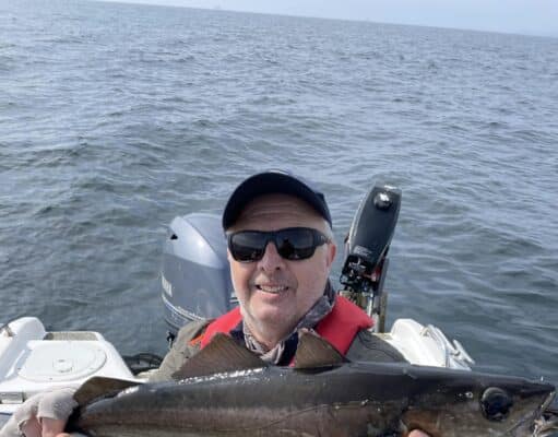 The comedian Bob Stevenson with a fine Pollack on the fly.