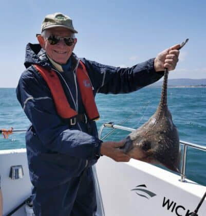 Dutch angler with a thornback ray