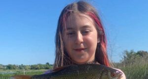 Young Robyn catches PB roach to show dad Dave how its done