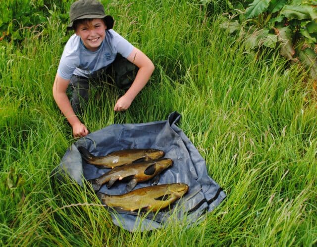 First ever Tench for 11 year old Leo is the reason he is all smiles with these lovely specimens.