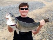 Super 76.5cm bass for young first-time angler Seán