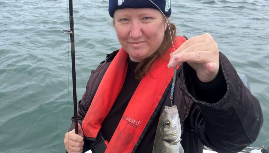Daisy Swette with a bass
