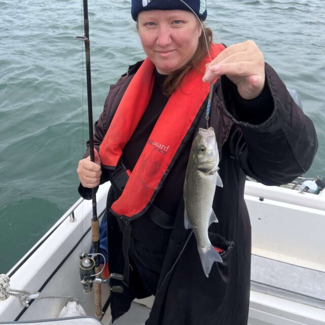Daisy Swette with a bass