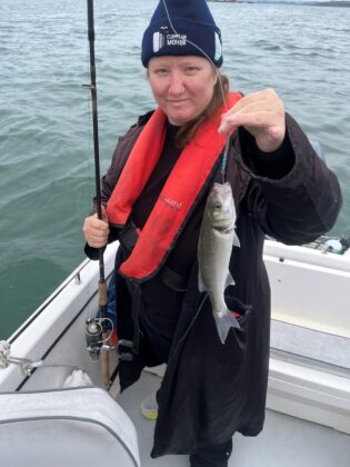 Daisy Swette with a bass