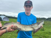 Double figure pike for determined young angler