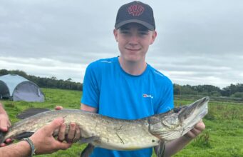 Double figure pike for determined young angler