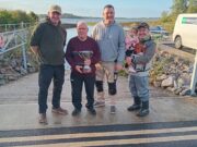 Anthony Doyle and David Galvin win Baggott Perpetual Cup on Lough O’Flynn Padraig Baggott cup in hand presenting Anthony Doyle & David Galvin joint winners, also Lena Rose Baggott at her first Baggott cup,with dad Ronan Baggott club Chairperson