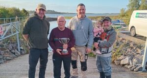 Padraig Baggott cup in hand presenting Anthony Doyle & David Galvin joint winners, also Lena Rose Baggott at her first Baggott cup,with dad Ronan Baggott club Chairperson