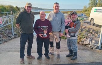 Anthony Doyle and David Galvin win Baggott Perpetual Cup on Lough O’Flynn Padraig Baggott cup in hand presenting Anthony Doyle & David Galvin joint winners, also Lena Rose Baggott at her first Baggott cup,with dad Ronan Baggott club Chairperson