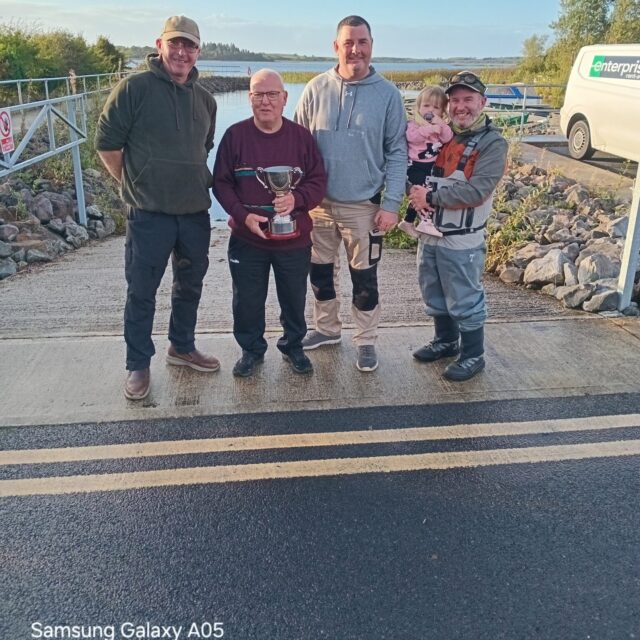 Padraig Baggott cup in hand presenting Anthony Doyle & David Galvin joint winners, also Lena Rose Baggott at her first Baggott cup,with dad Ronan Baggott club Chairperson