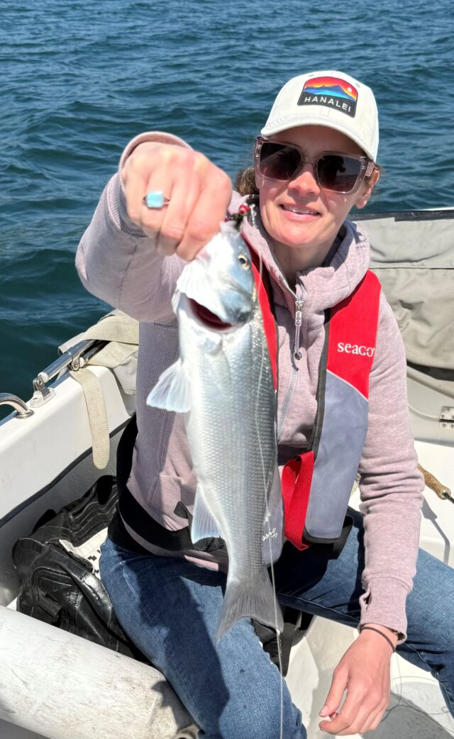 Nadya Shewczyk with a fly caught bass aboard SeaHawk